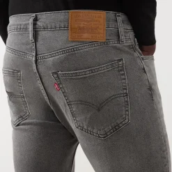 512™ Mid-Rise Slim Tapered Jeans