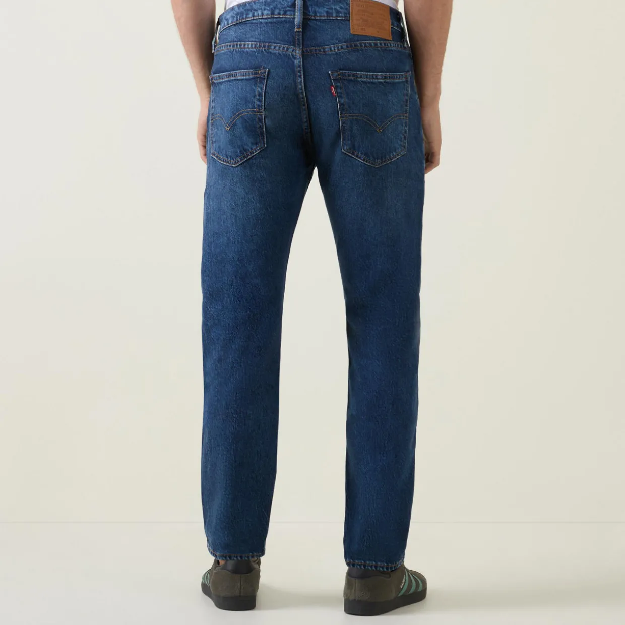 502™ Mid-Rise Tapered Jeans