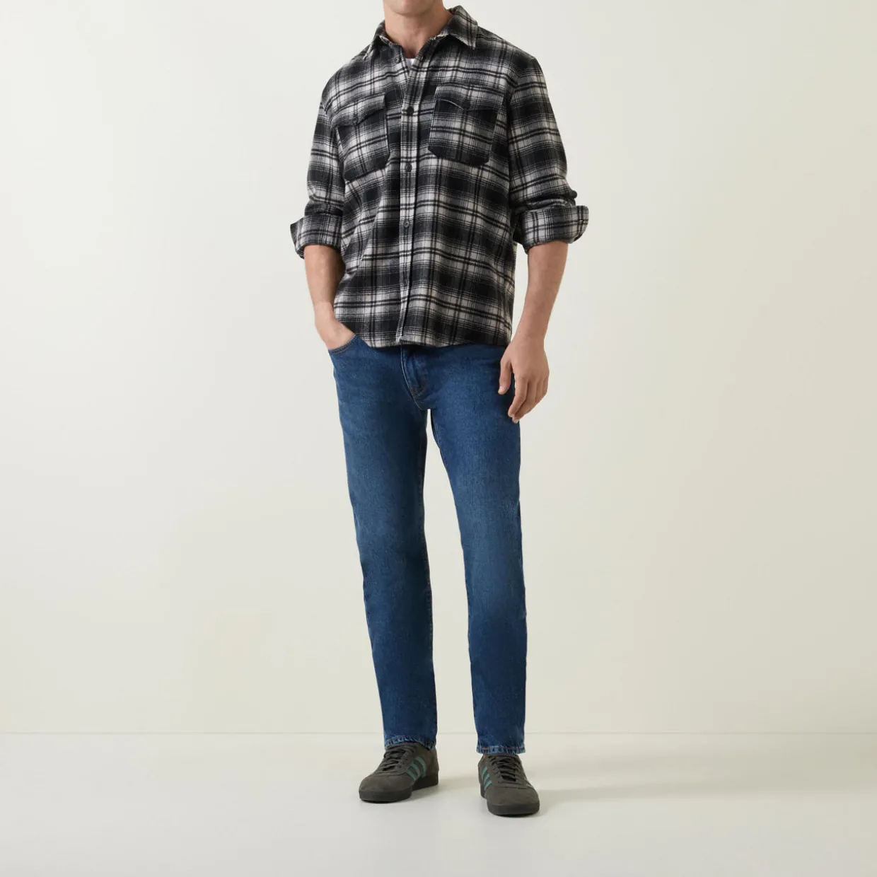502™ Mid-Rise Tapered Jeans